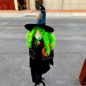 Witch costume with wig and fishnets